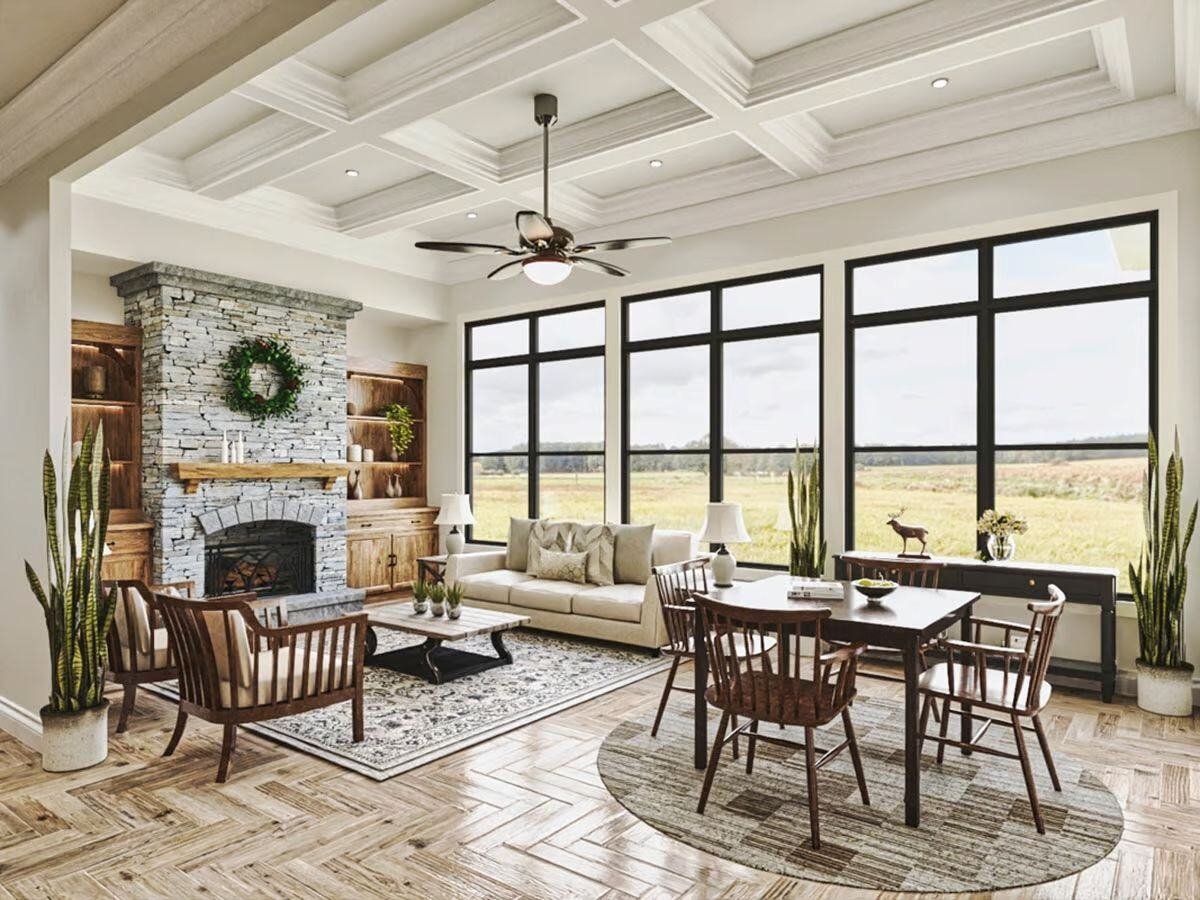 Living Room with Large Window Wall and Coffered Ceilings in The Craftsman Lake House with Walkout Basement by Architectural Designs and Triple Crown in Raleigh