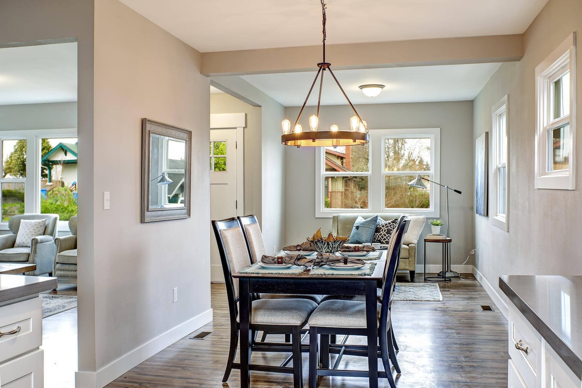 Open-concept dining and living space in a whole home remodel by Triple Crown Contractors in Apex, NC